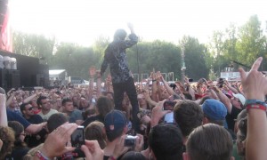 Nick Cave standing on the crowd